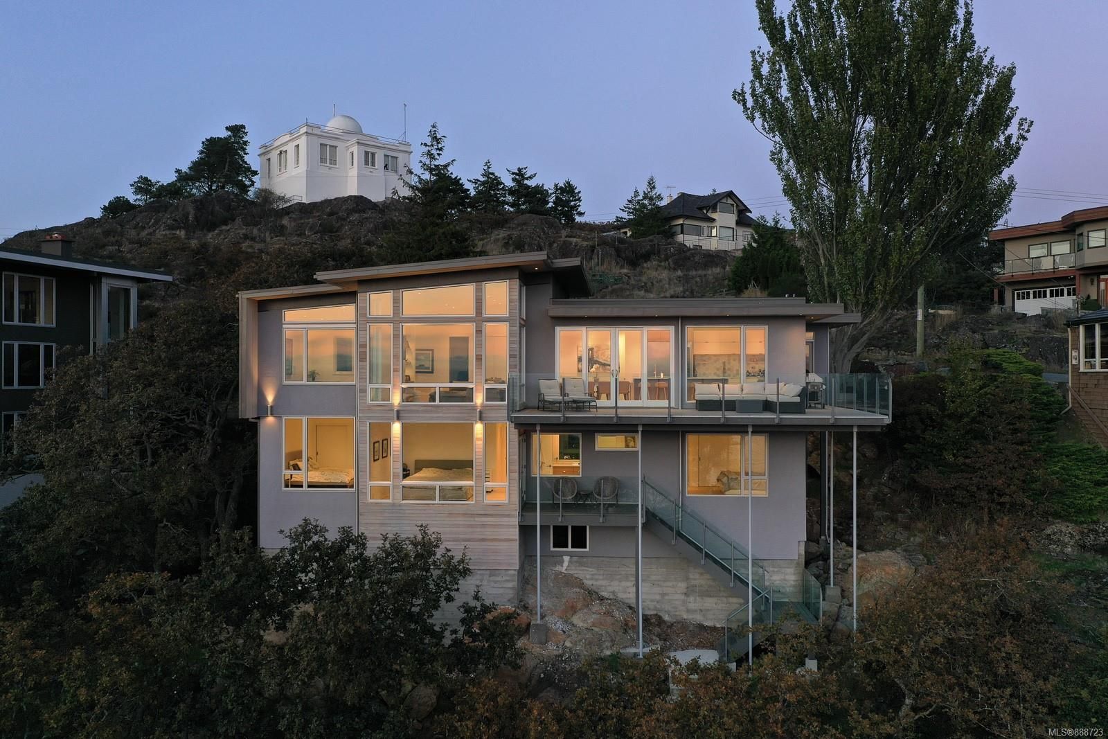 Modern Victoria home illuminated at dusk